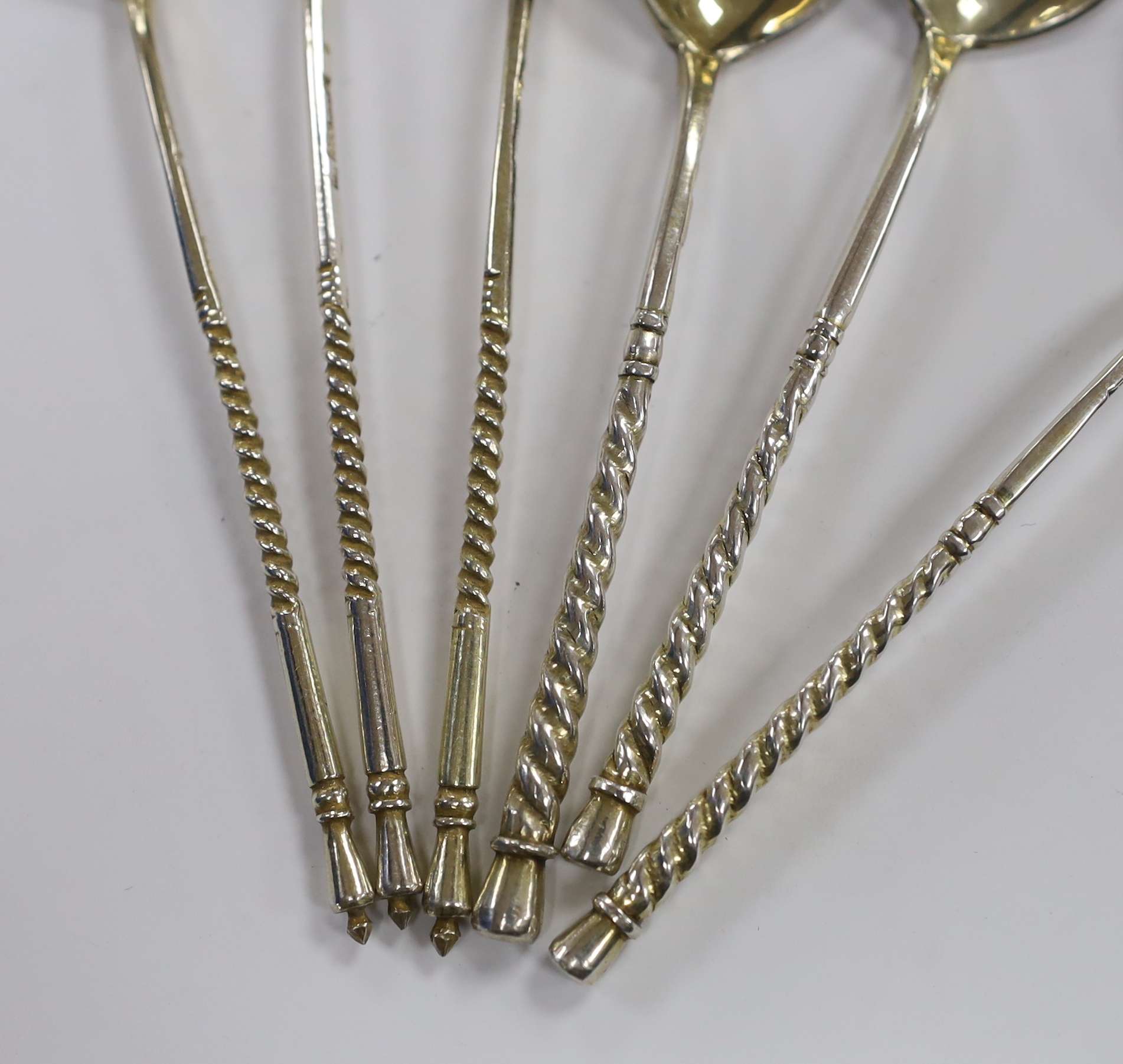 Three 19th century Russian 84 zolotnik and niello teaspoons, 1867 and three similar parcel silver gilt teaspoons, 12.8cm, gross 91 grams.